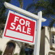 Sold Home For Sale Sign & New House